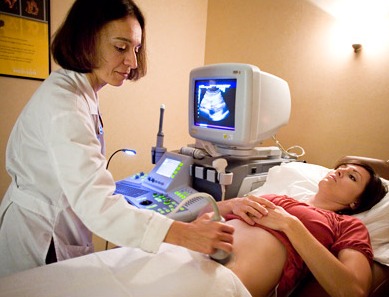 Pregnant woman getting ultrasound